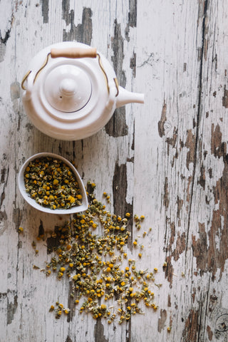 Loose tea leaves and teapot
