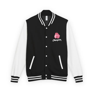 Front of the Breast Cancer Champion varsity letterman jacket in black with white sleeves and a pink boxing glove chest crest