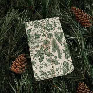 Botanical toile Christmas gift wrap in forest green and cream on evergreen boughs
