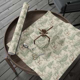 Deer and pine forest toile wrapping paper unrolled on a wooden table