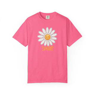 Comfort Colors® Sunshine Daisy Smile T-shirt available in vibrant pink featuring a smiling daisy floral graphic by Artisan Grove.