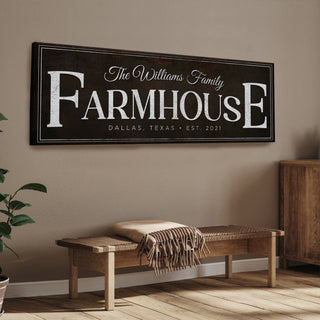 Farmhouse-style wall sign with family name and location in a home interior.