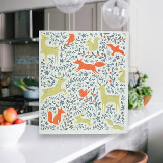 Forest Animals Swedish Dishcloth with orange and olive woodland animals in a modern kitchen