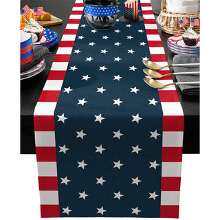 Table runner with American flag design on a dining table with festive decorations.