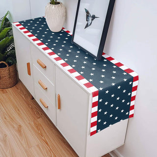 White cabinet with a decorative table runner featuring an American flag design.