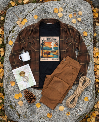 Fall layering flat lay: burnt brown plaid flannel, Yellowstone long sleeve tee and tobacco double knee canvas pants – Artisan Grove